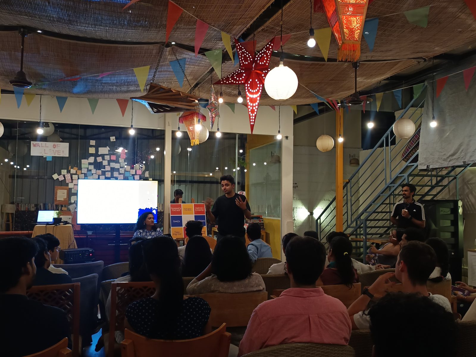 A speaker addresses members at an evening Policy Circle