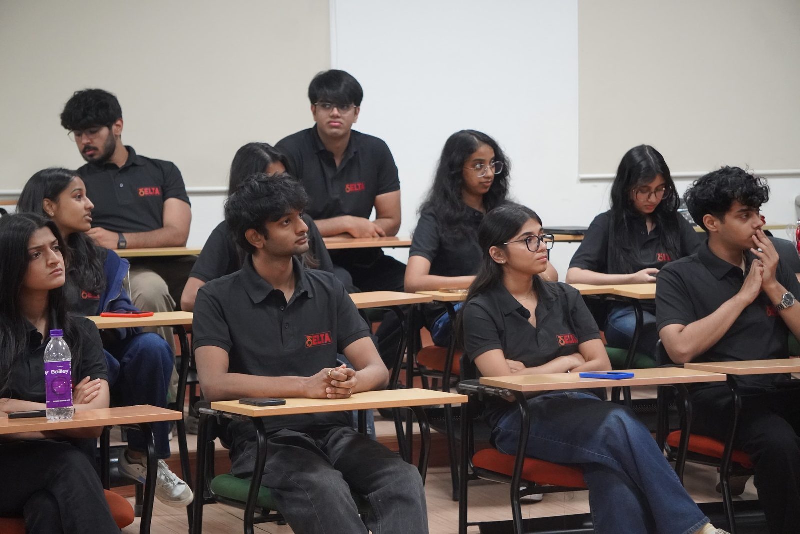Students in a session with a partner university cohort