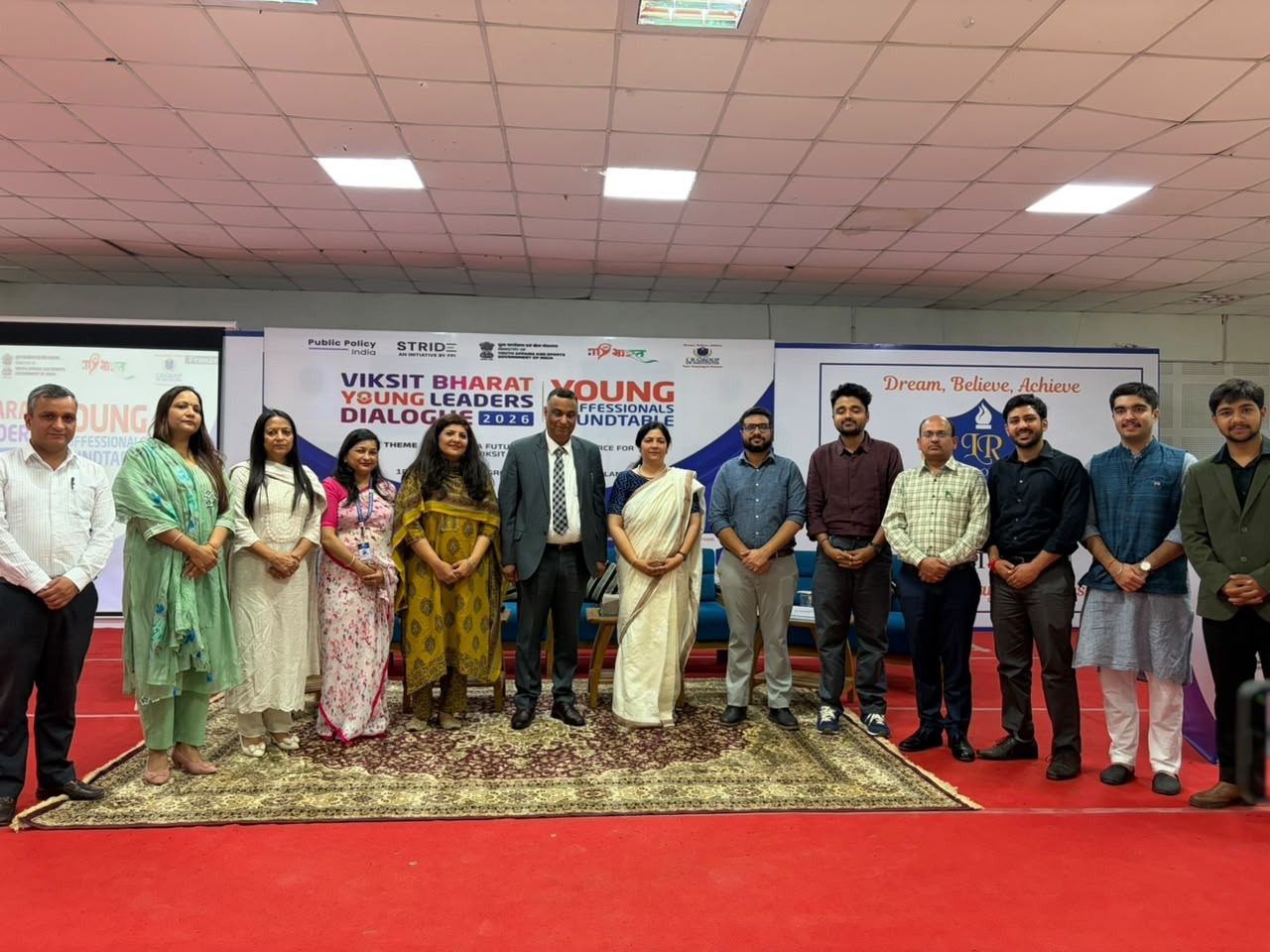 Participants and organisers on stage at a Viksit Bharat Young Professionals Roundtable
